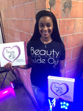 woman wearing beauty from the inside out t-shirt in black with white font