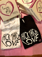 Display of White and black thick thigh love v-neck t-shirts with love boxes